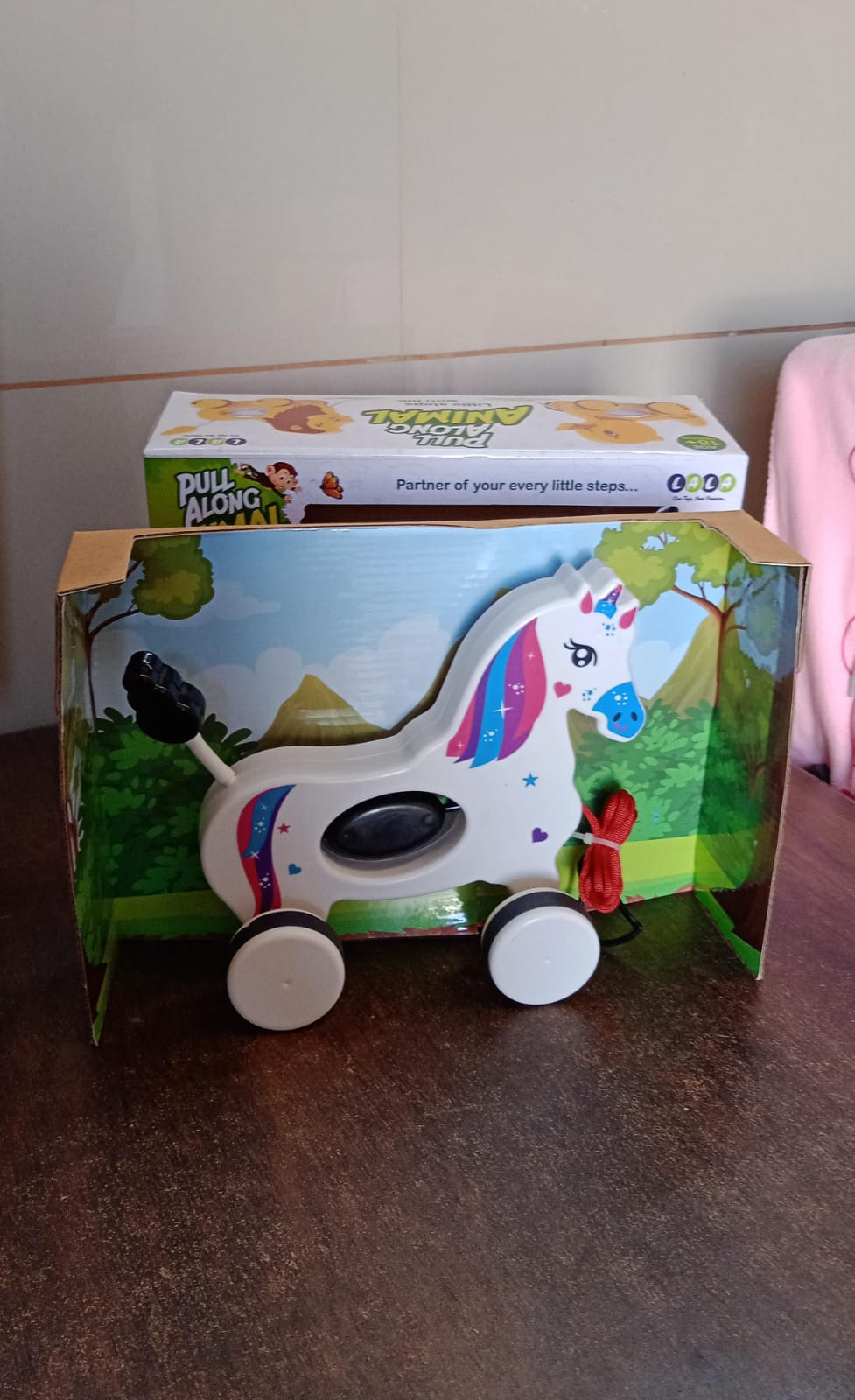 Unicorn pull along toy displayed packed in retail packaging ready for sale