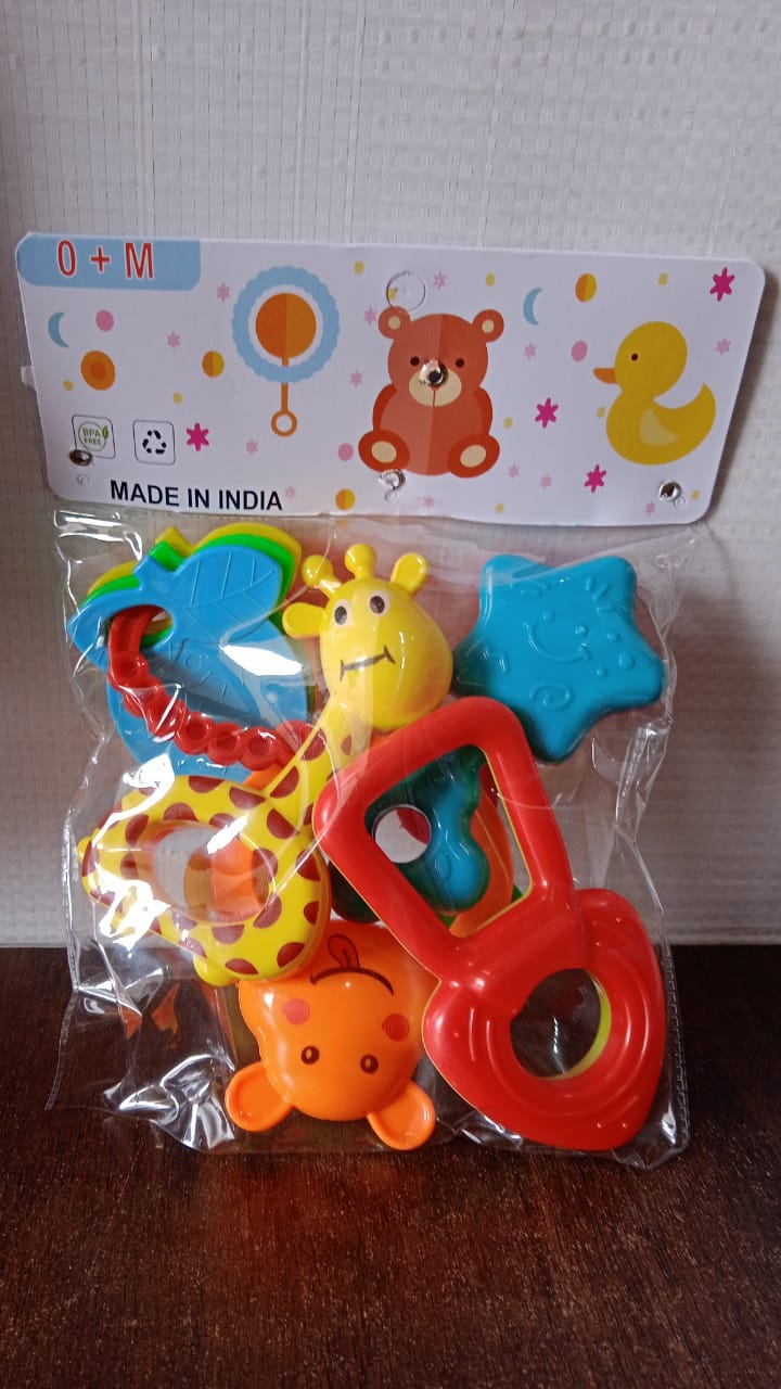 Overhead view displaying all five baby rattle toys in the set