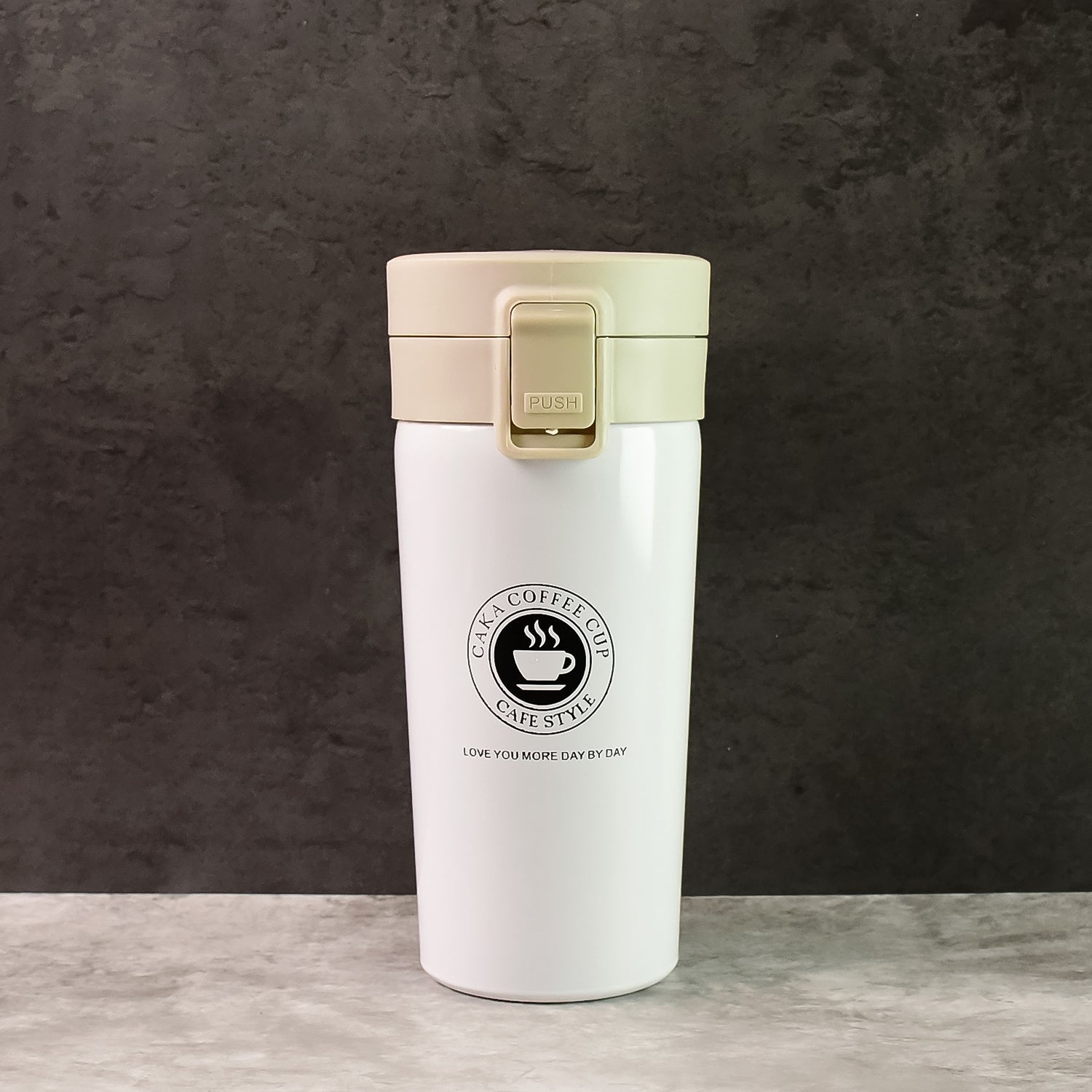 Close-up of stainless steel vacuum insulated coffee flask showing specifications