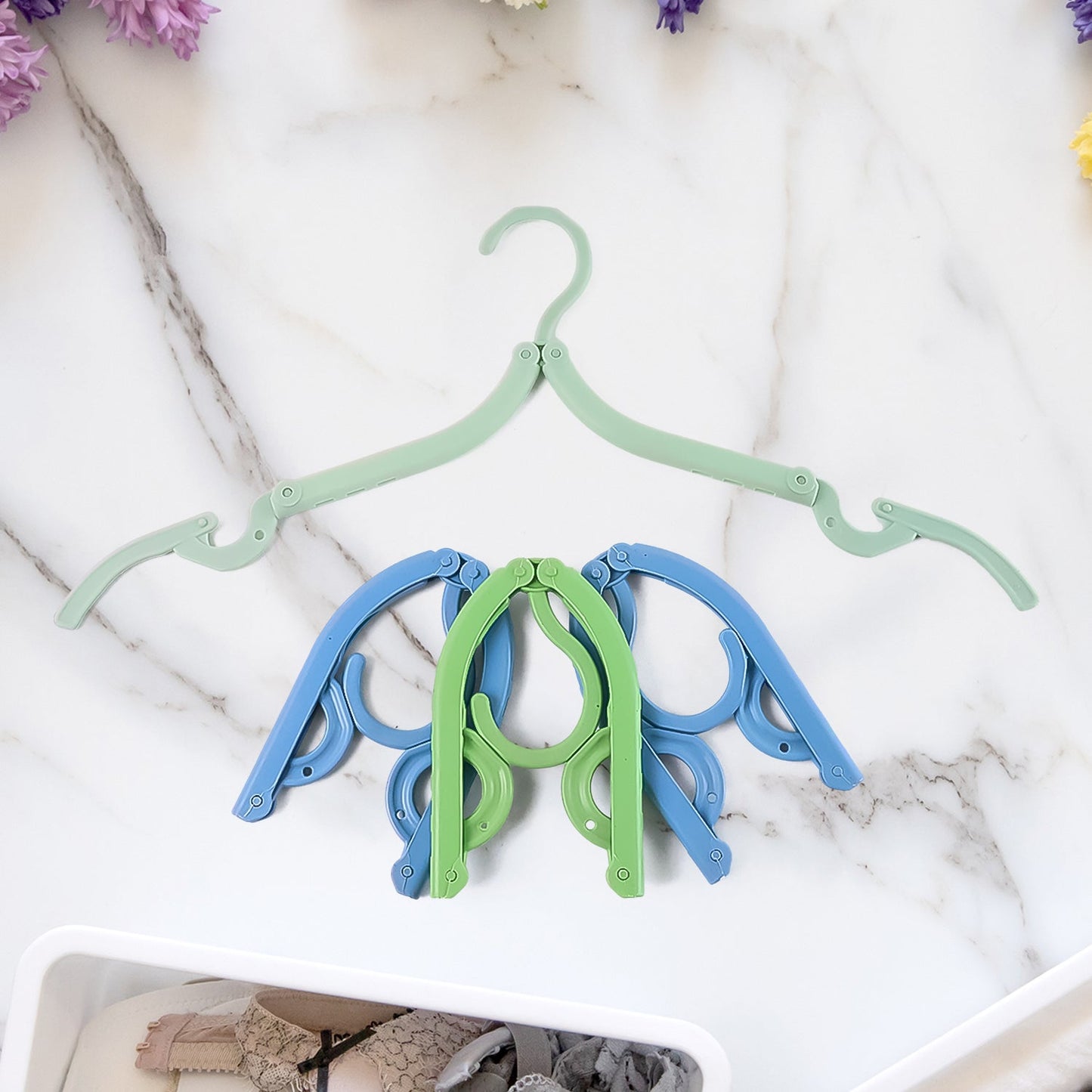 Folded lightweight compact travel hanger ready for packing