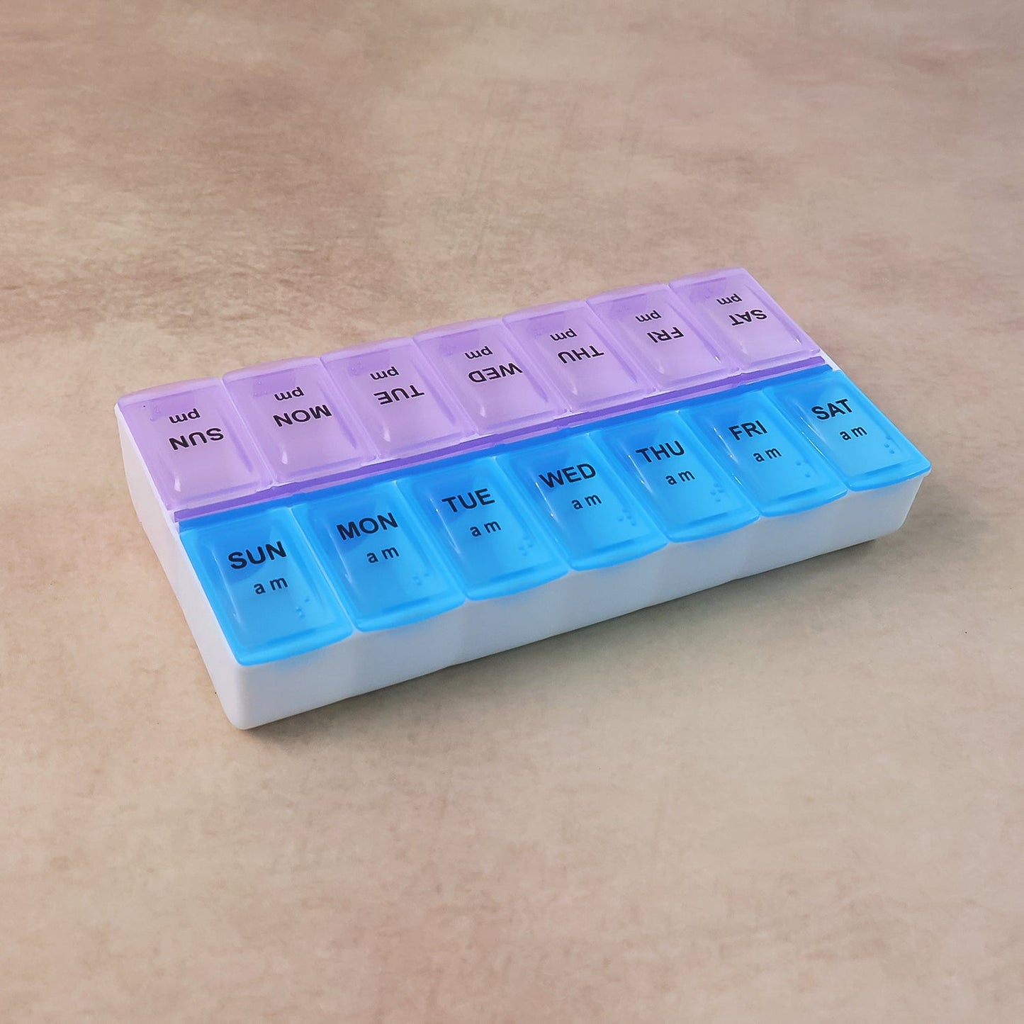 Travel-friendly weekly medicine organizer with detachable lids