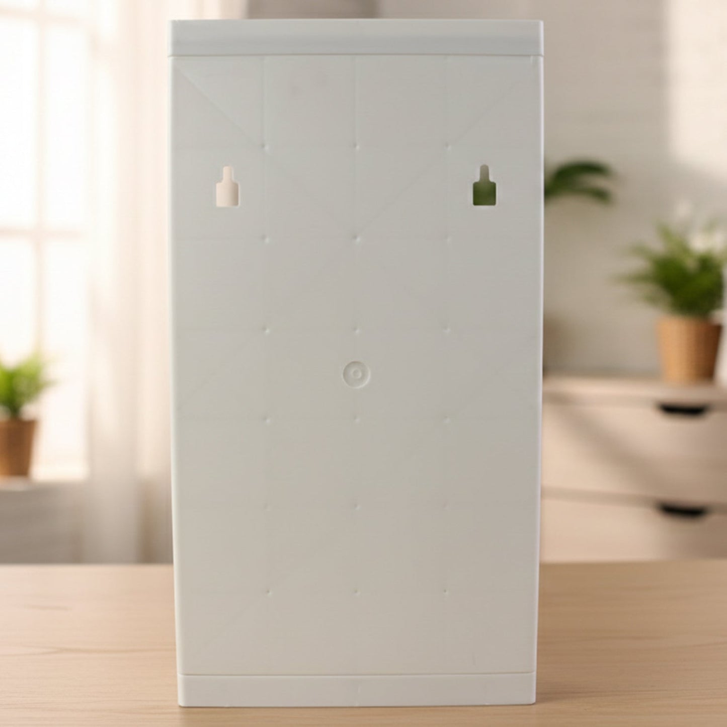 Compact multipurpose bathroom storage unit with rotating mirror door