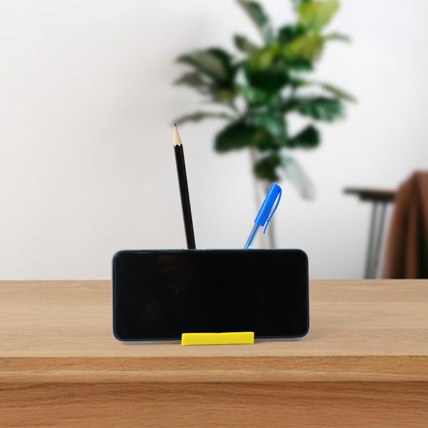 Mobile phone stand with dual pen holder, sturdy plastic design for desk