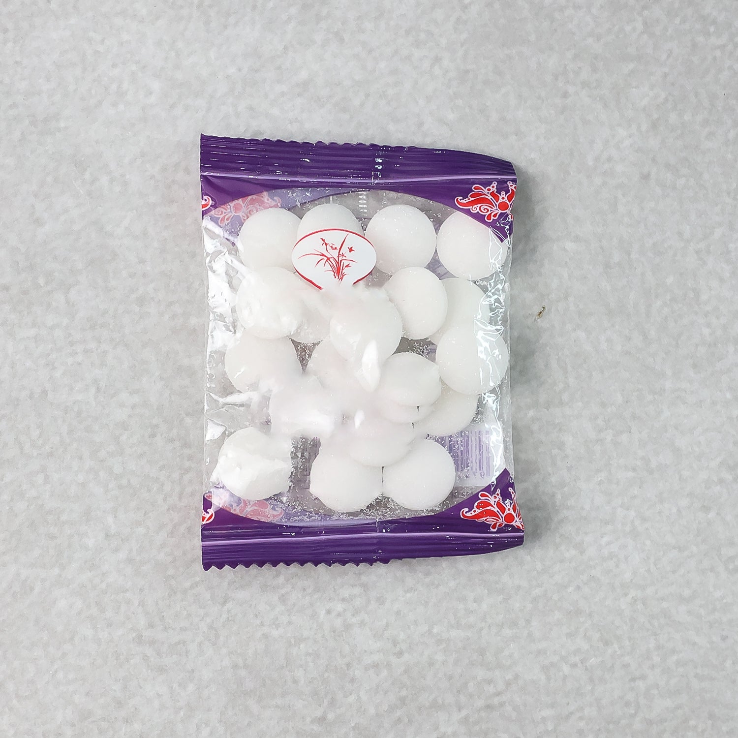 Close-up image of round naphthalene mothball tablets for wardrobe freshness
