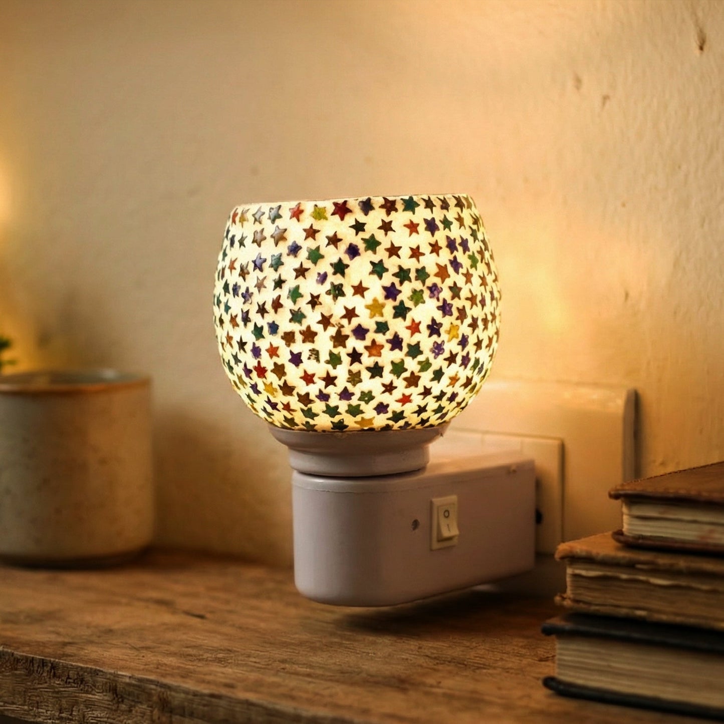 Star pattern night lamp plugged into outlet featuring built-in on/off switch