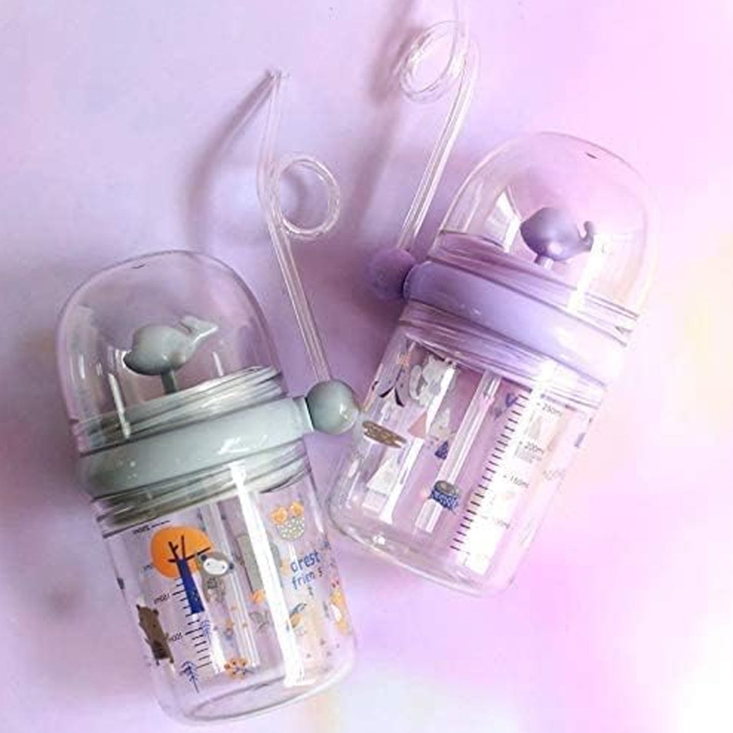 The Whale Spray Sippy Cup disassembled for easy cleaning, highlighting its simple components.
