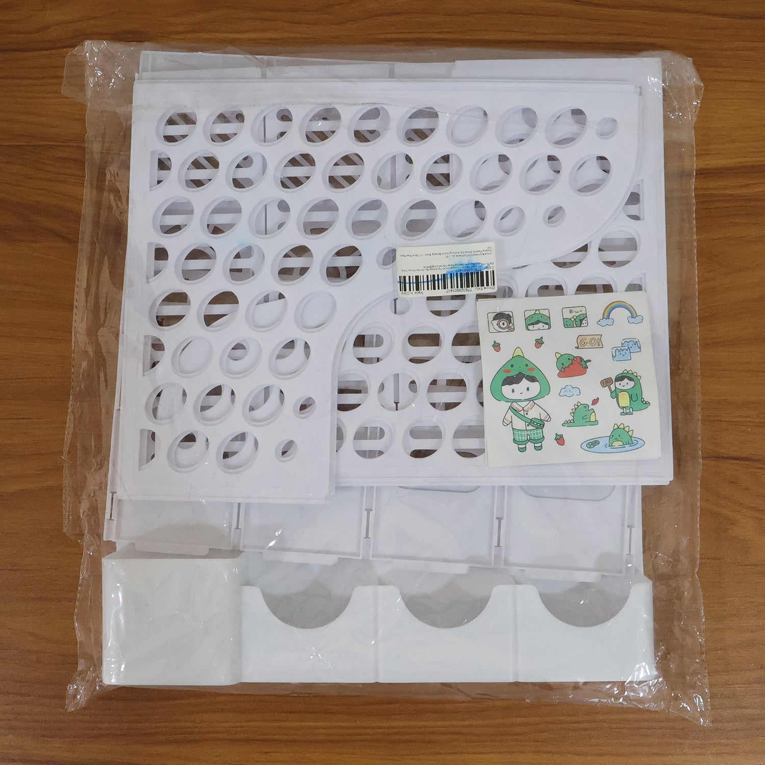 Organized workspace featuring vertical file holder and pen compartments.