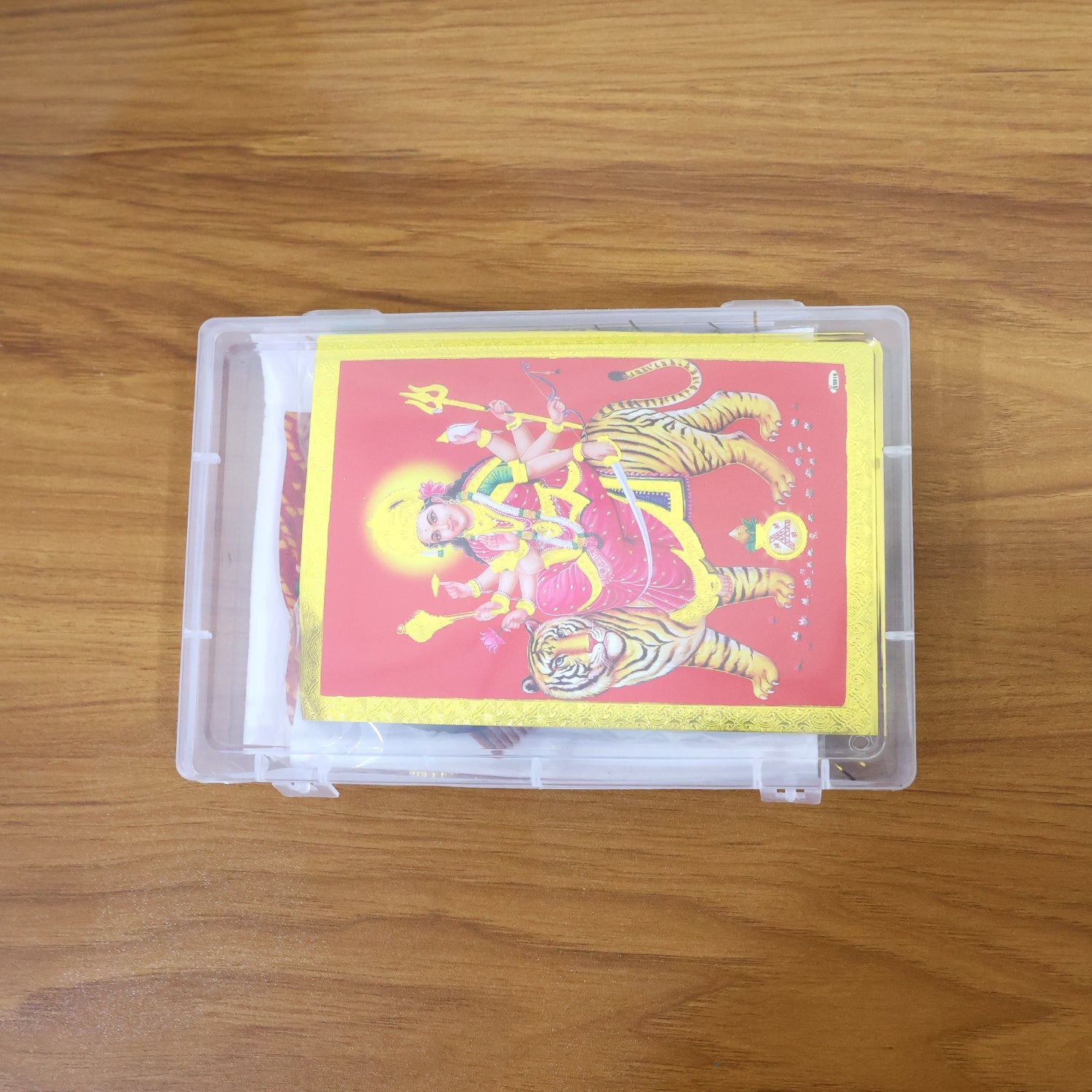 Decorative Mataji pooja set with chunri, jewellery, and mirrors for worship