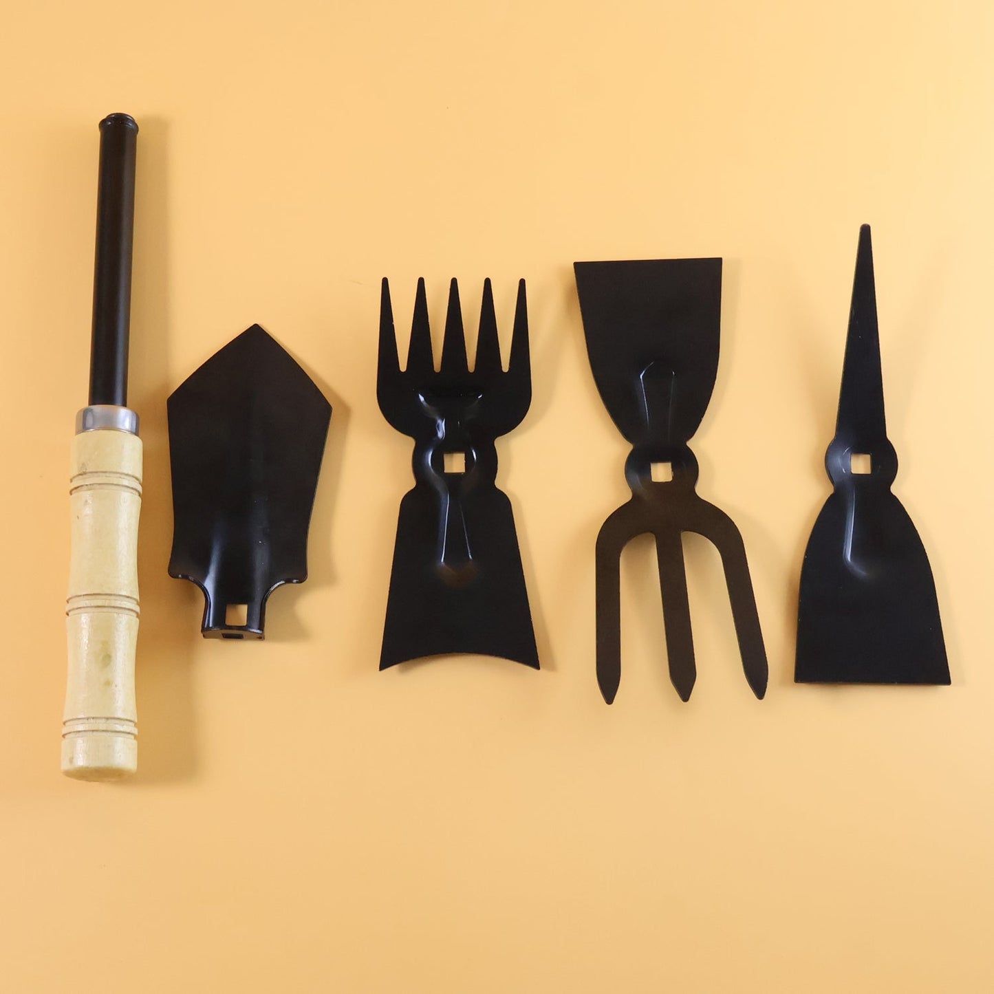 Complete gardening hand tool kit in use for planting and weeding