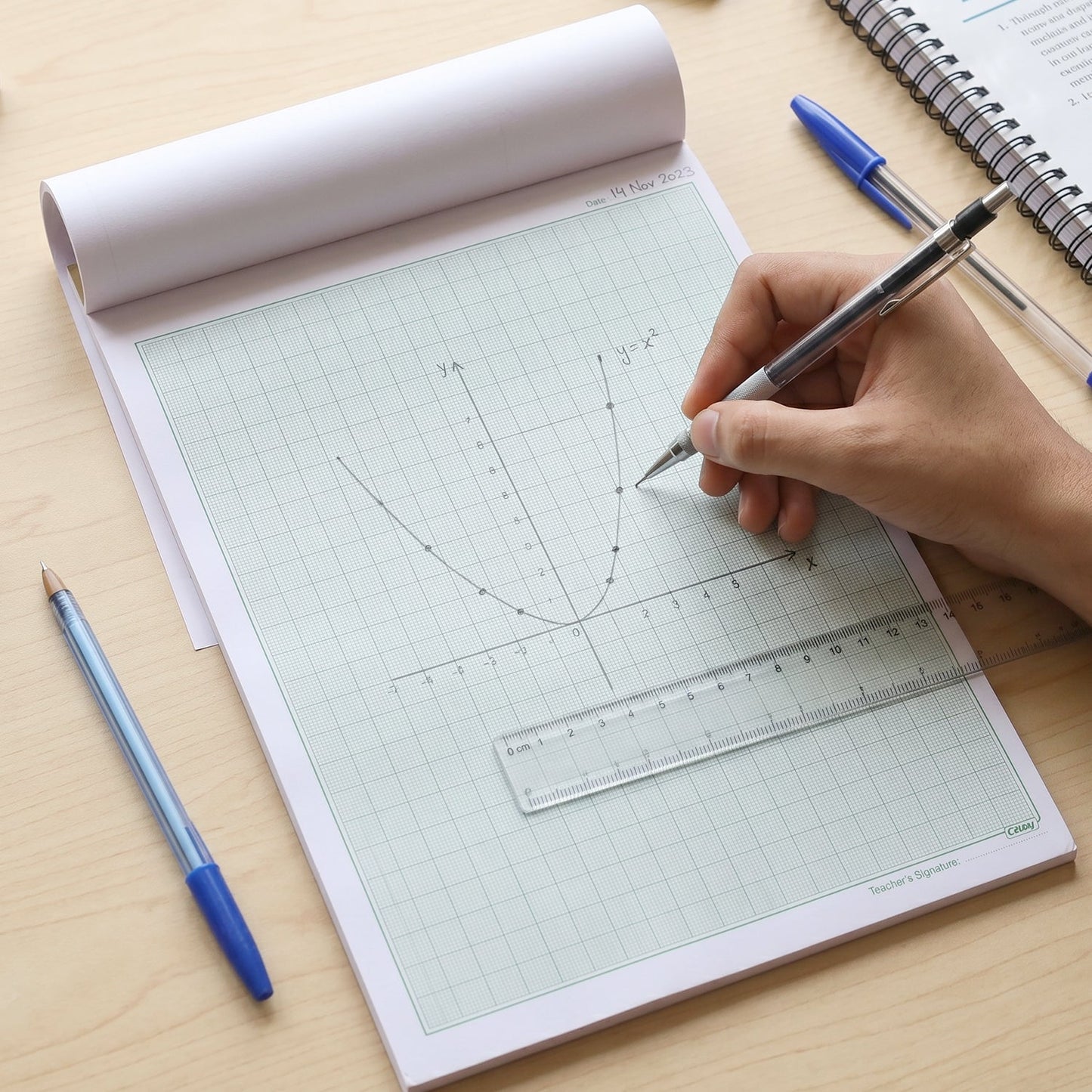 Lifestyle scene of graph paper used for drawing and drafting