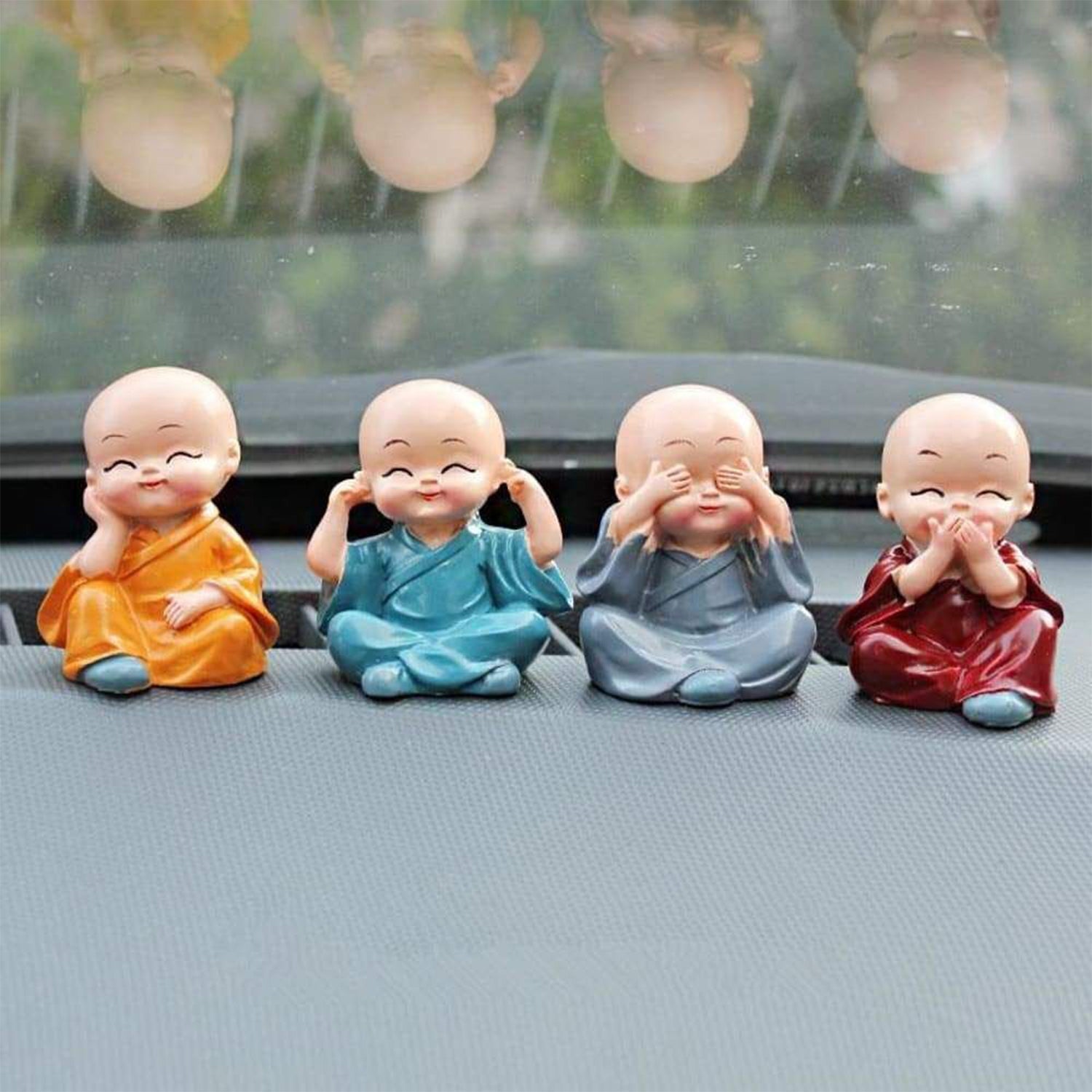 Adorable Baby Buddha showpiece set with four monk statues, perfect for home decor.