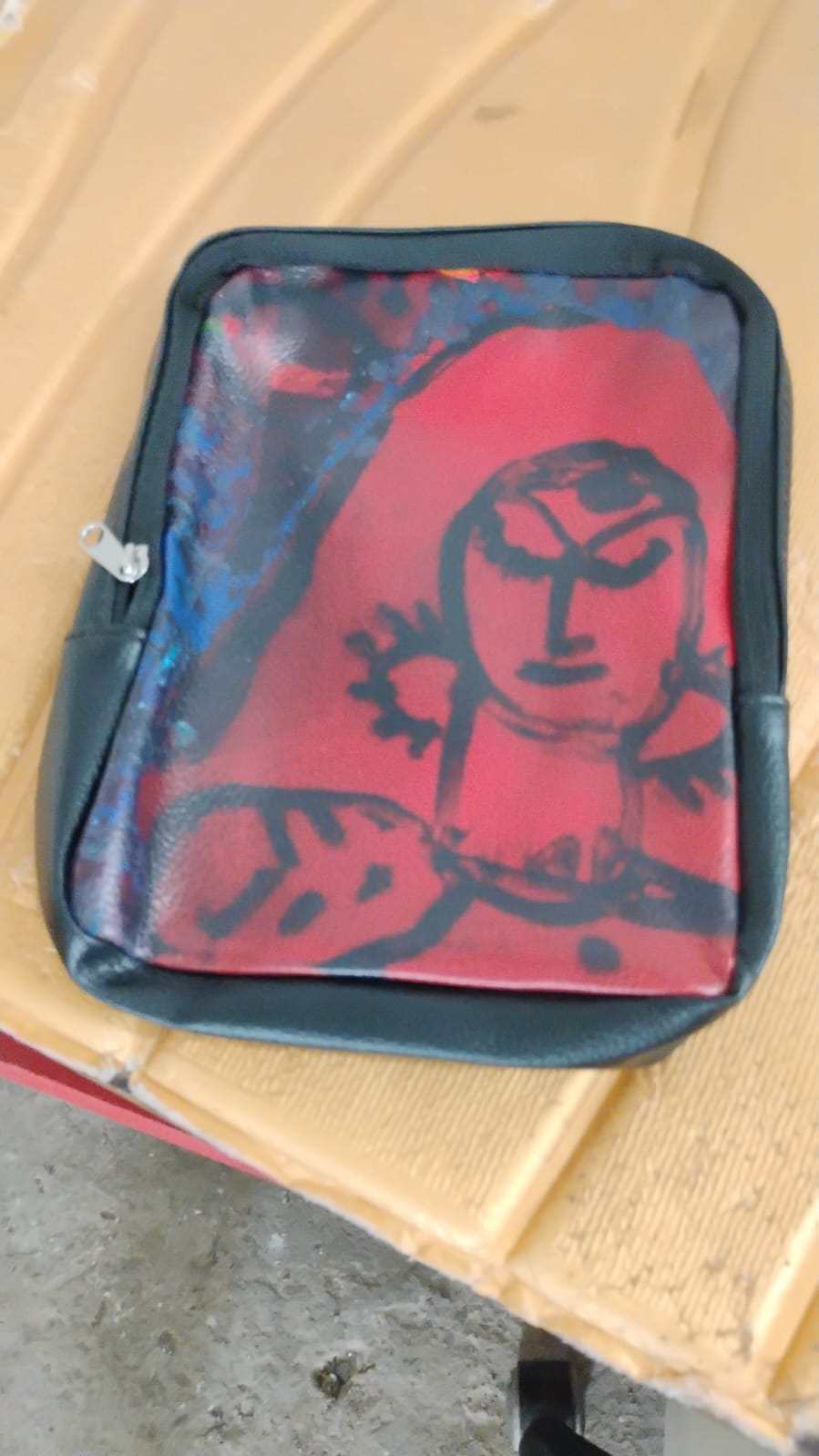Side view of compact multipurpose zipper pouch with traditional design