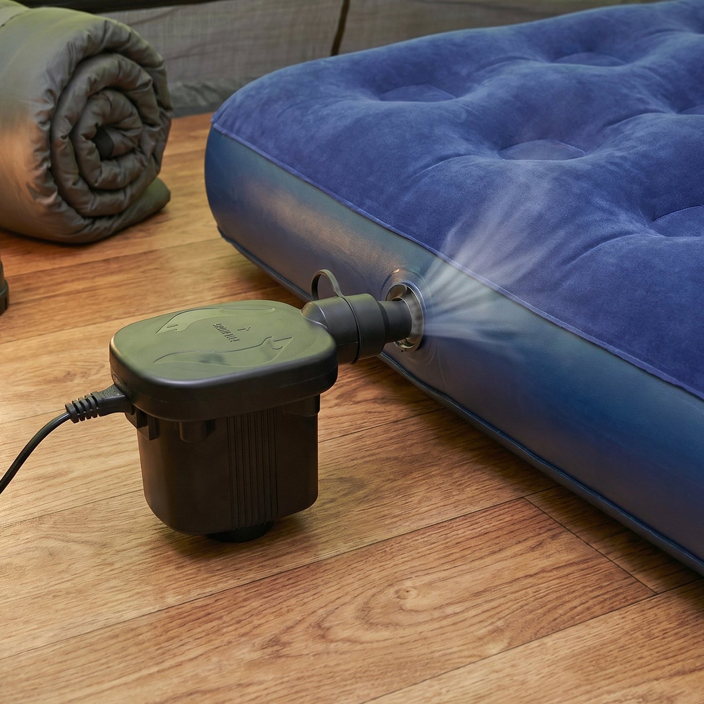 Electric air pump efficiently inflating a vibrant pool float for summer fun.