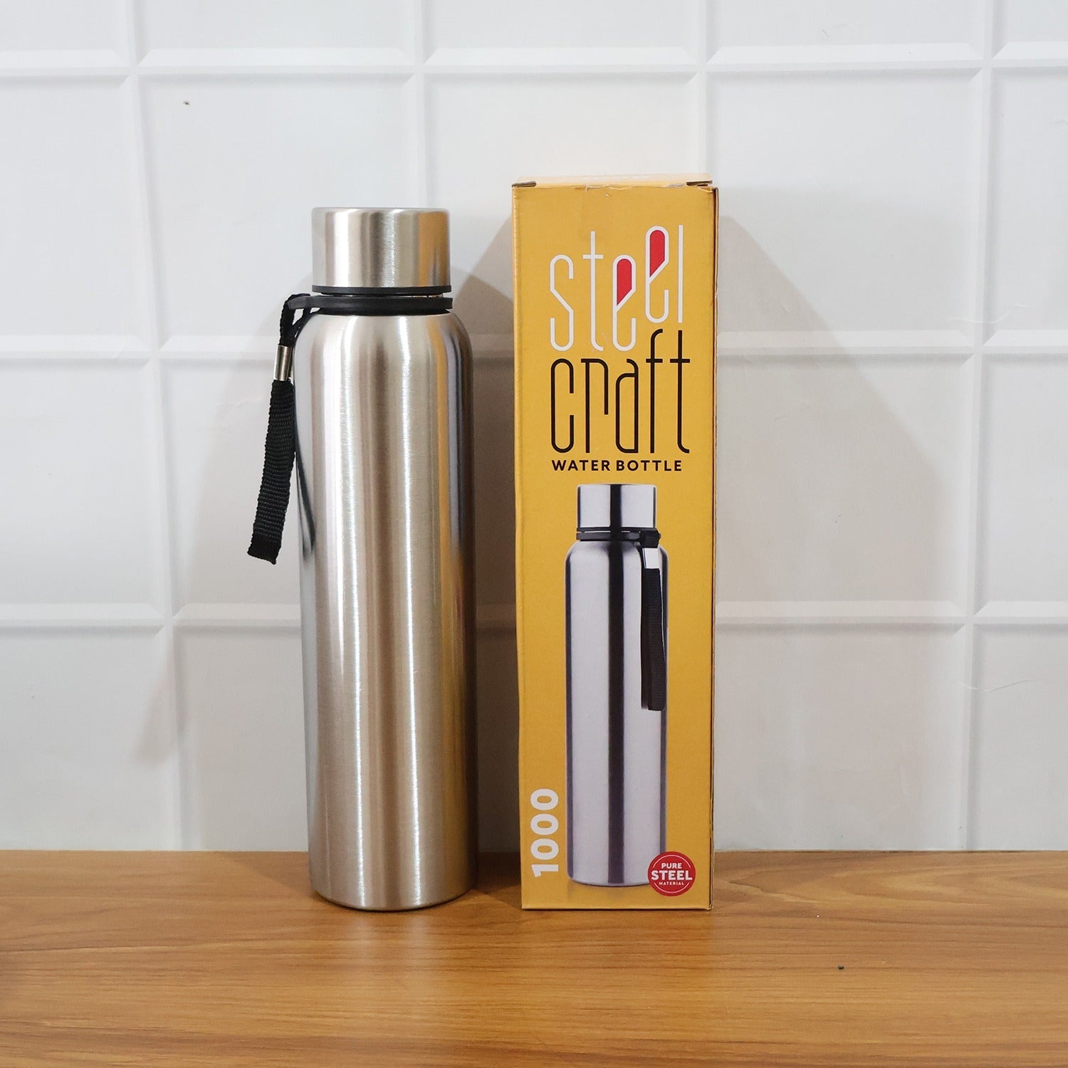 Comparison shot demonstrating the compact design of the 1000ml water bottle.