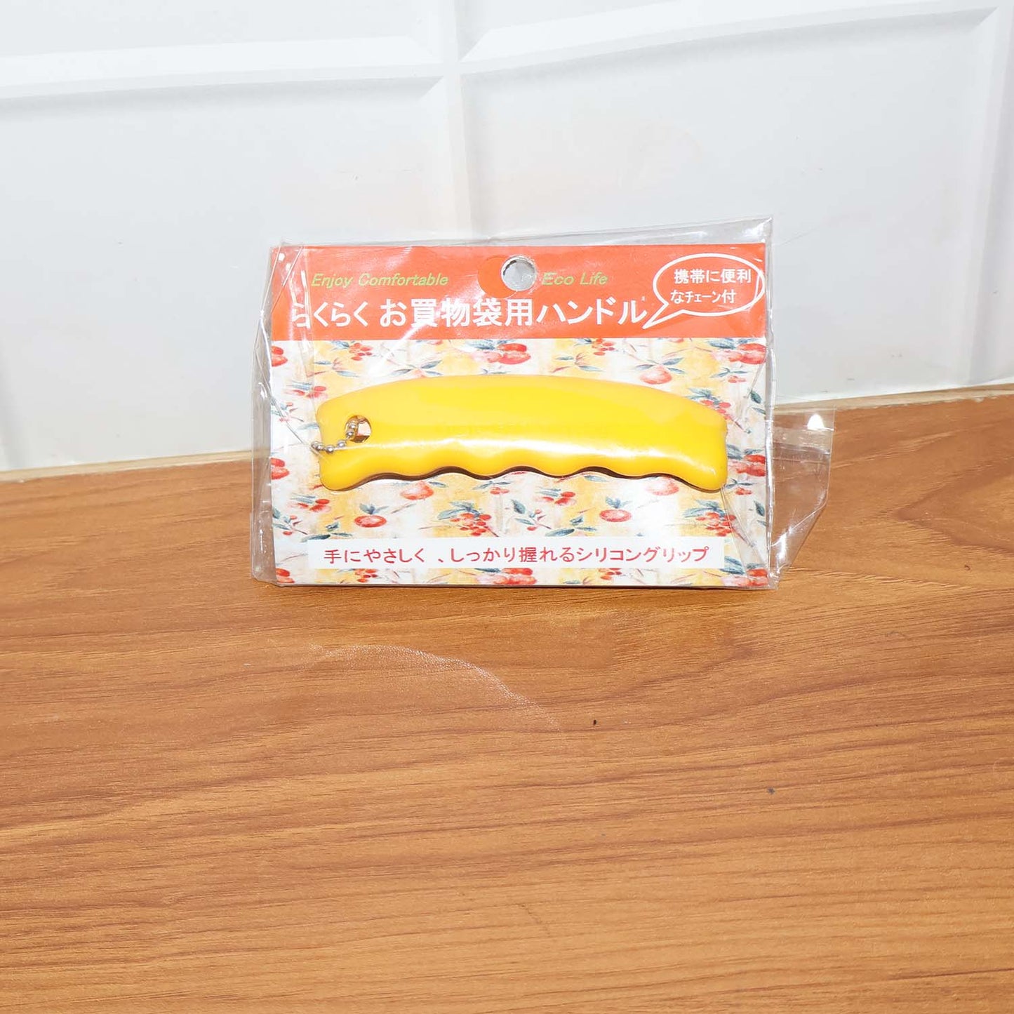 Person using the JourneyMate Silicone Bag Carrier for groceries, showcasing real-world use.