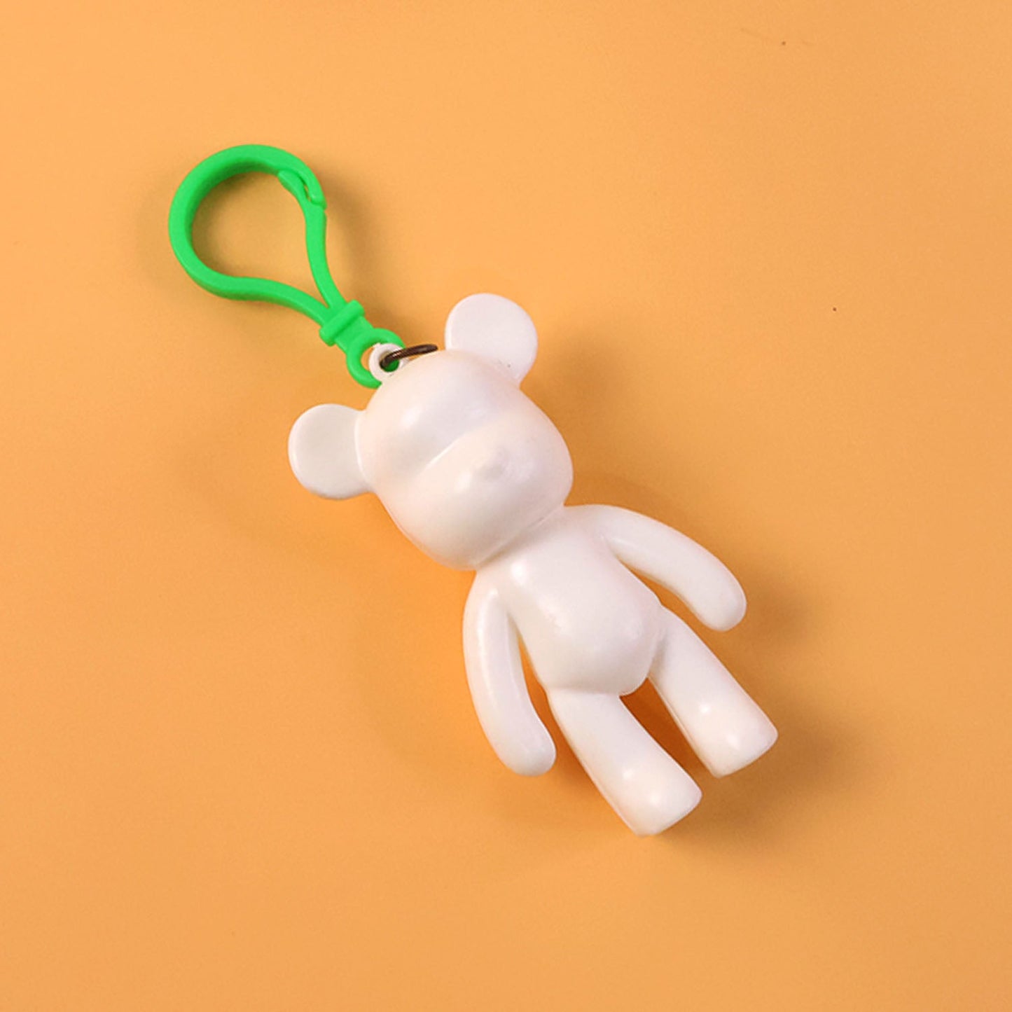 Lightweight bear shape keychain displayed on handbag strap