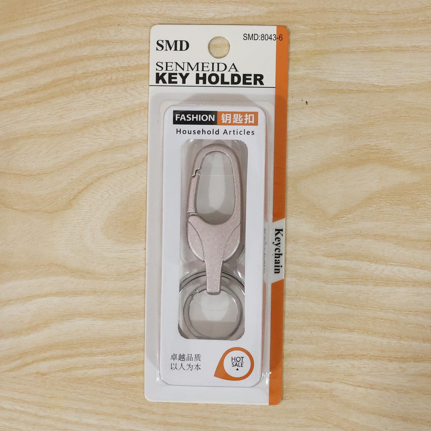 Metal keychain displayed with size reference