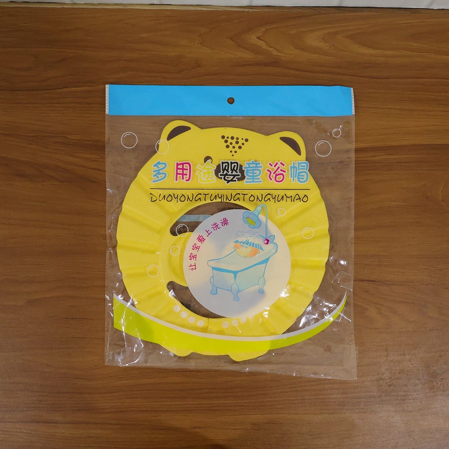 Detail of the adjustable baby shower cap, ensuring a comfortable and secure fit for tear-free bath time.