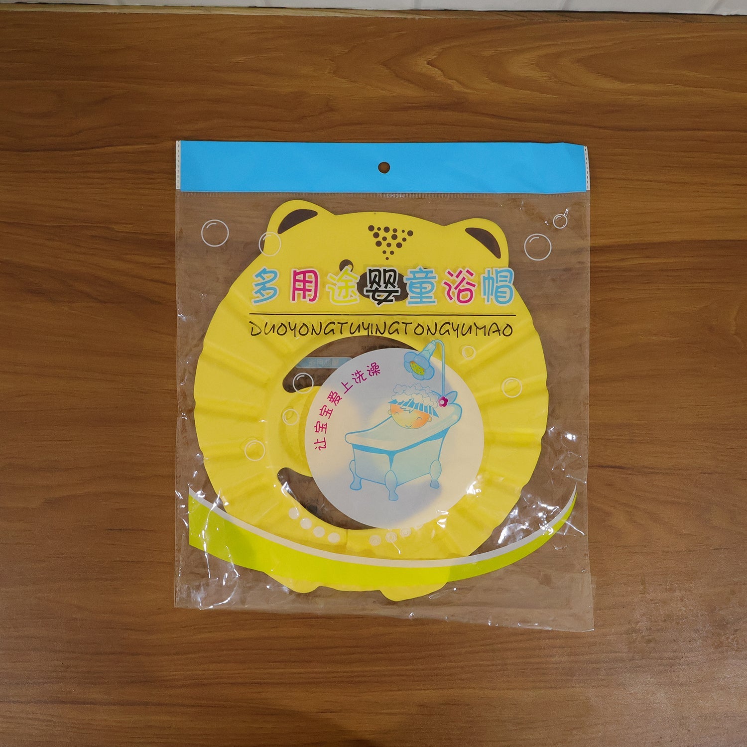 Detail of the adjustable baby shower cap, ensuring a comfortable and secure fit for tear-free bath time.