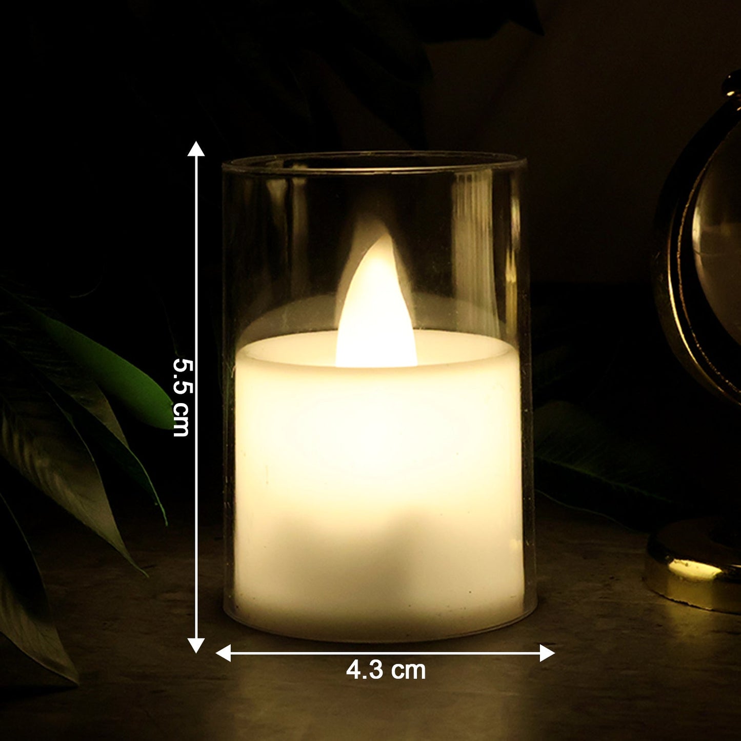Flickering LED tealight candle glowing warmly in glass holder