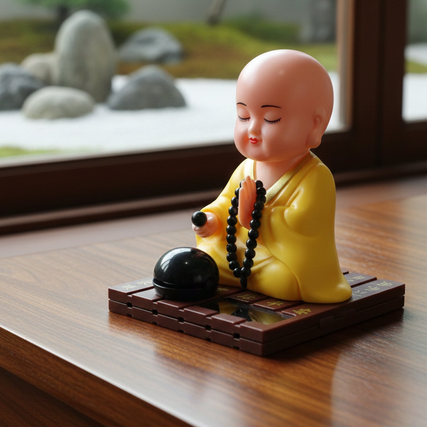 Solar powered Buddha statue showing smooth moving parts