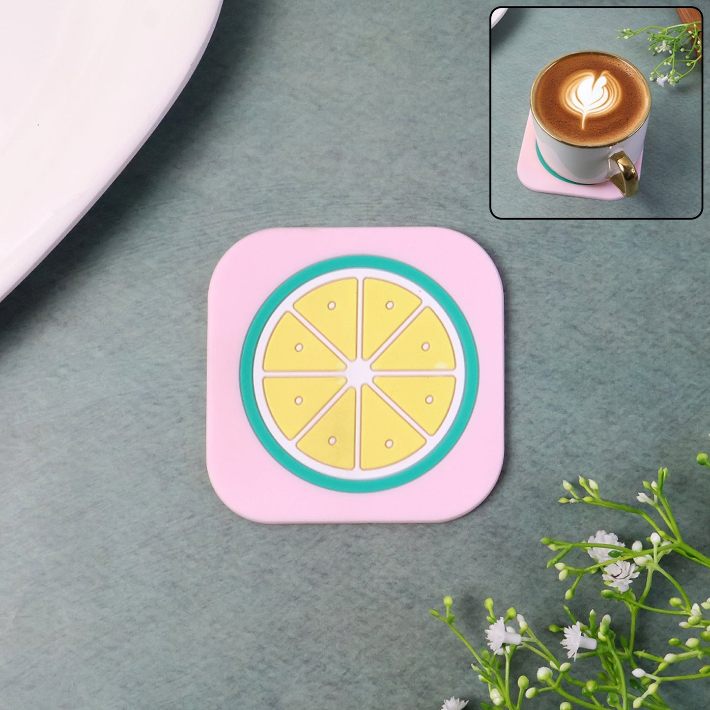Heat-resistant silicone lemon drink coaster on wooden table