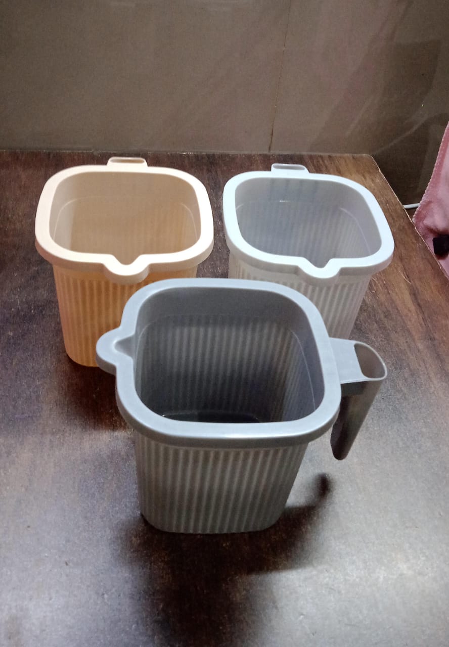 Plastic Bath Mug placed in a bathroom setting, ready for use during bathing.