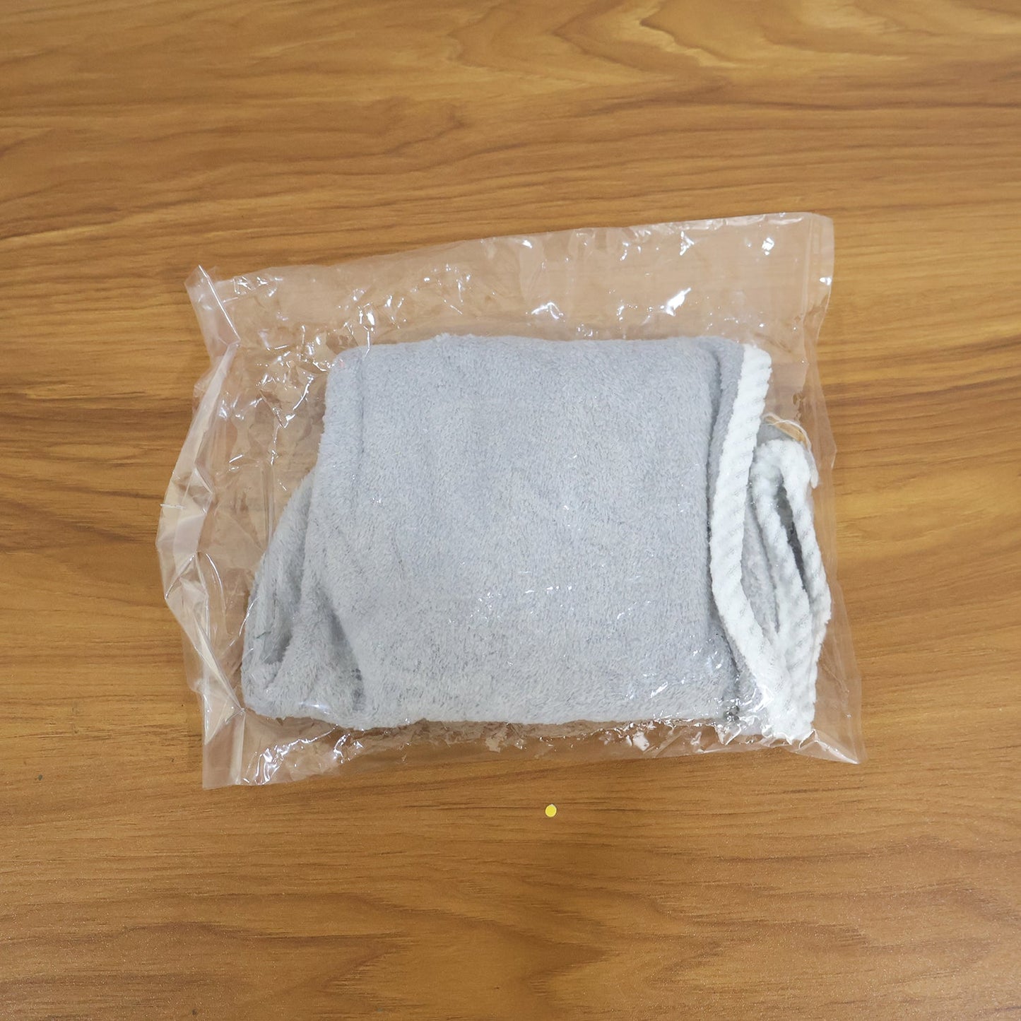 Woman comfortably wearing the turban towel for women while relaxing.