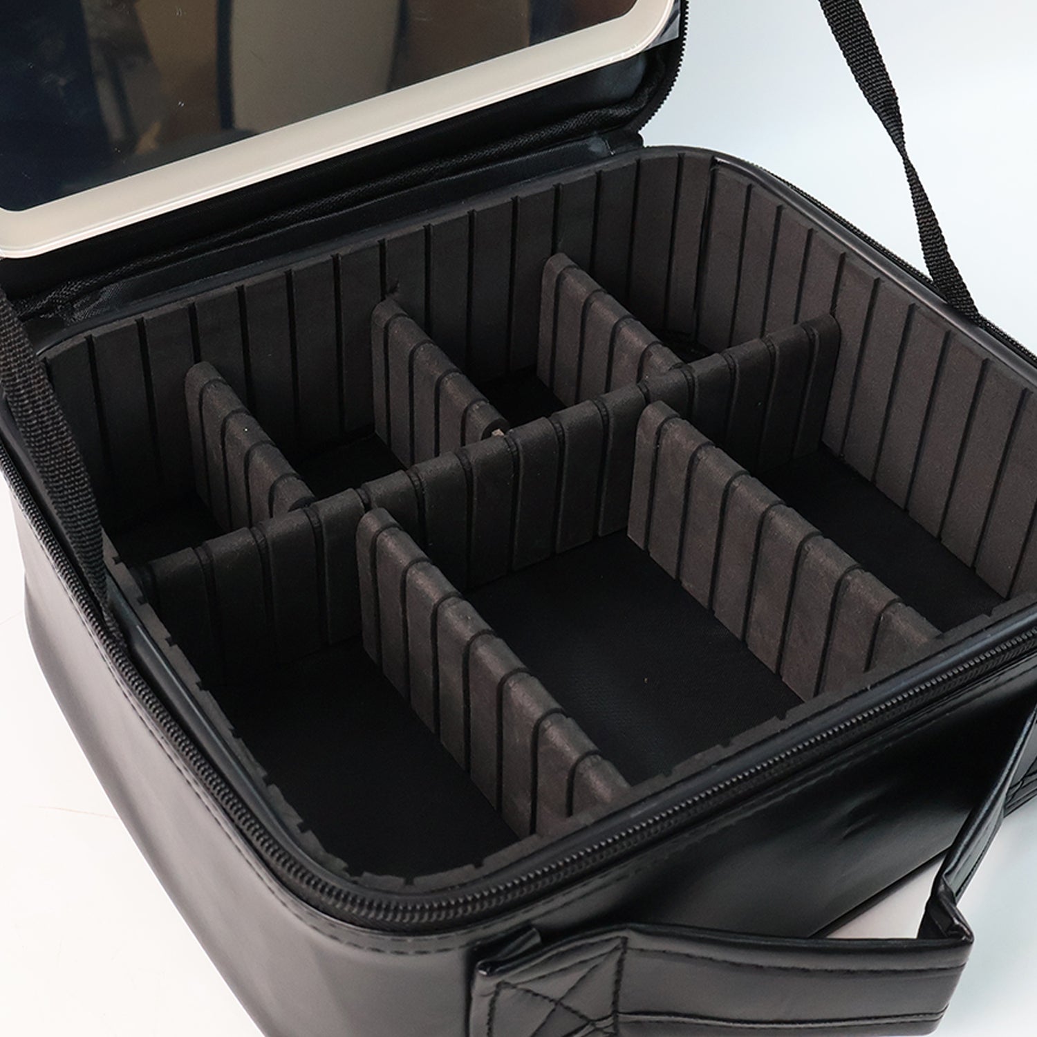 Side view of black LED cosmetic organizer box showing sleek design